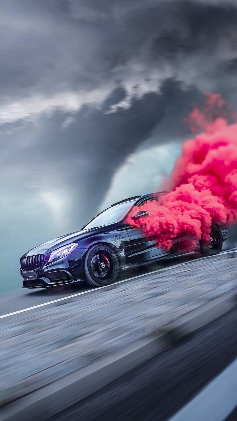 Black Mercedes-Benz drifting amidst thick pink tire smoke under a dark, heavy sky of swirling storm clouds.