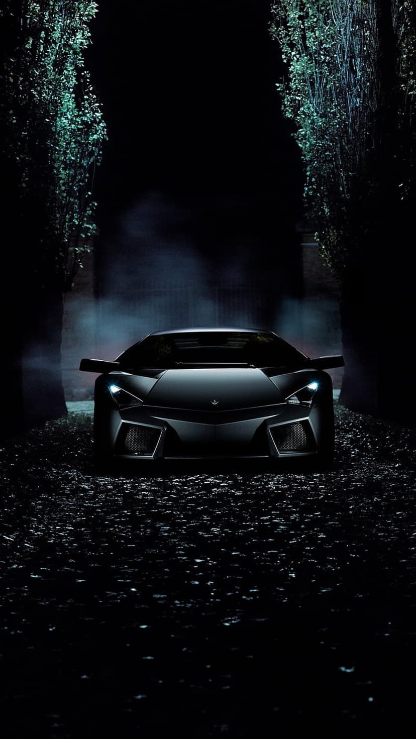 Black sports car with glowing headlights emerges from a foggy forest at night on a narrow woodland road.