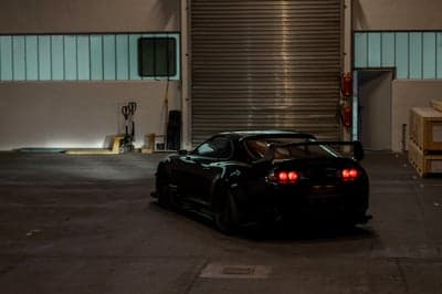 Stealth Black Toyota Supra Industrial Warehouse Phone Background
