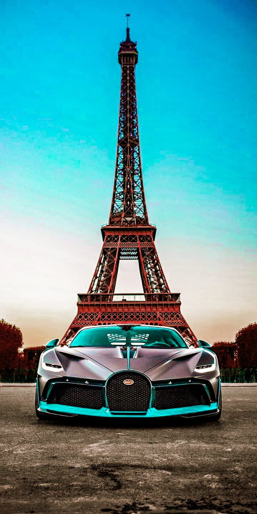 Bugatti Chiron with cyan accents parked on a Parisian street with the Eiffel Tower and blue sky in the background.