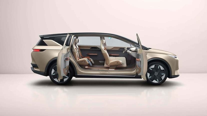 Side view of a champagne-colored concept electric SUV with open doors showing a minimalist luxury interior.