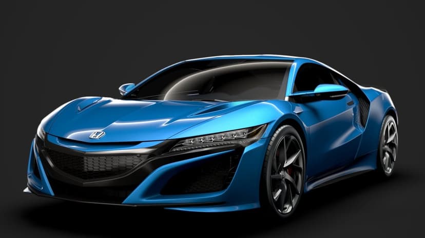 Metallic blue Honda NSX supercar with LED headlights and black alloy wheels on a dark studio background.
