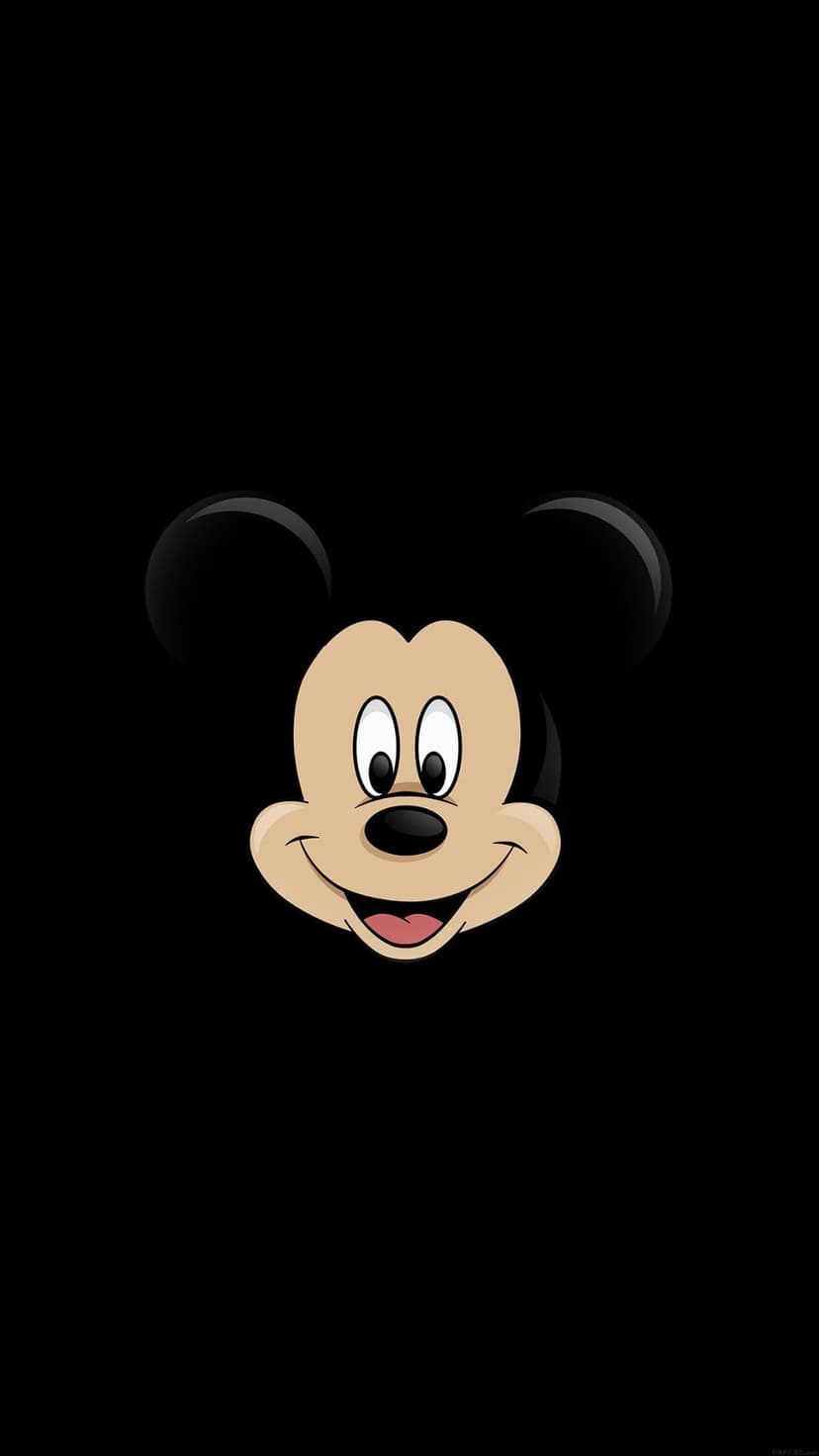 Mickey Mouse face with large ears and a joyful smile centered against a deep solid black background.
