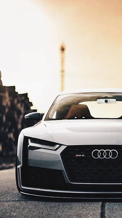 Close-up of a white Audi RS6 front grill and headlights