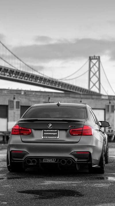 Matte Black BMW M3 Under Bay Bridge at Dusk