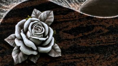 Stone Rose Sculpture on Granite Gravestone