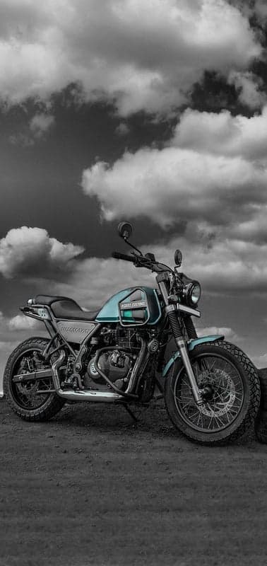 Monochrome Motorcycle Against Dramatic Sky