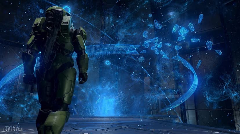Master Chief from behind looks at a shattered blue holographic Halo ring in a dark metallic sci-fi room.