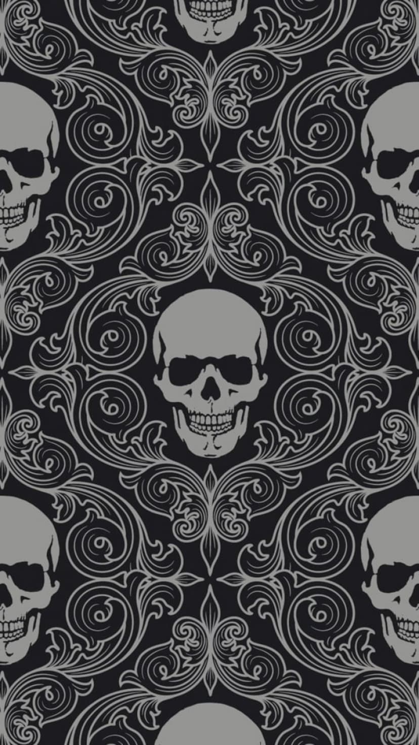 Grey gothic skulls nestled among intricate black damask swirls and baroque floral filigree in a repeating pattern.