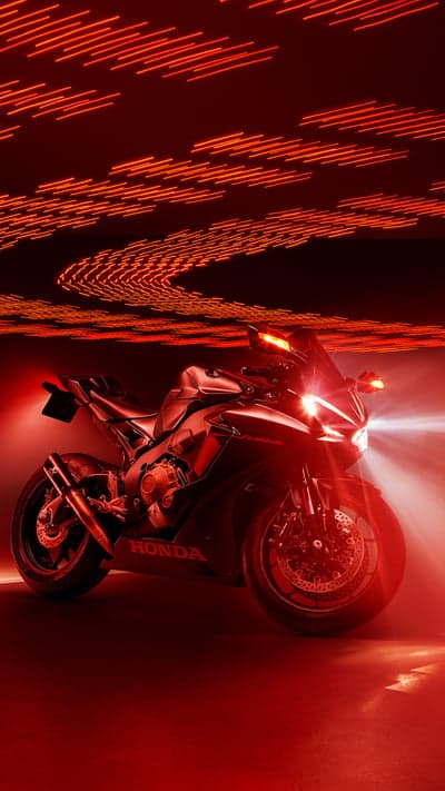 Honda CBR Motorcycle Illuminated by Red Neon Lights