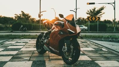Ducati Motorcycle at Sunset on Tiled Pavement
