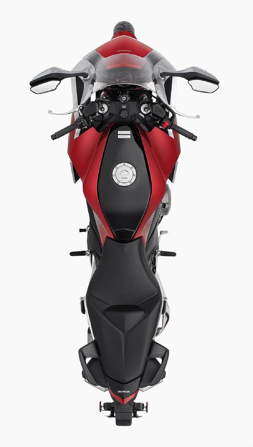 Red Honda sportbike seen from above with a black seat and metallic fairing against a solid white background.