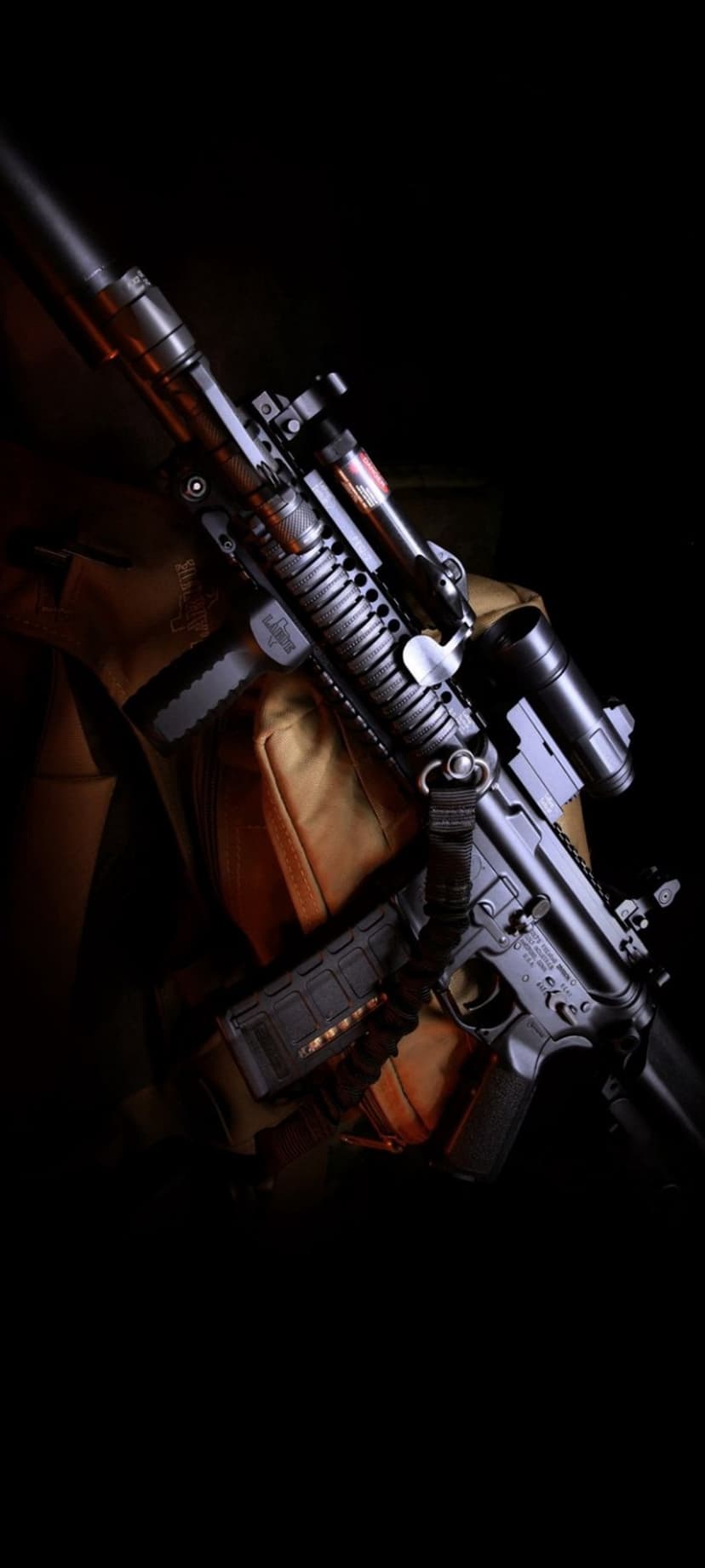 Tactical rifle with an optical scope and loaded magazine captured in dark, high-contrast dramatic lighting.