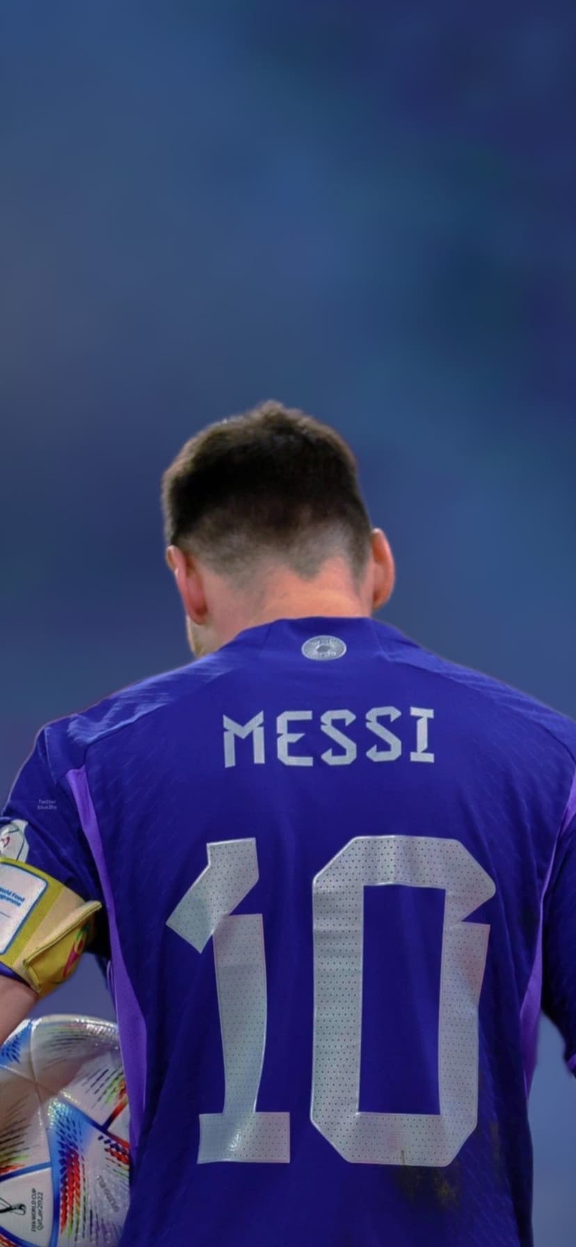 Lionel Messi's blue Argentina jersey back with silver number ten and nameplate on a textured soccer wallpaper.