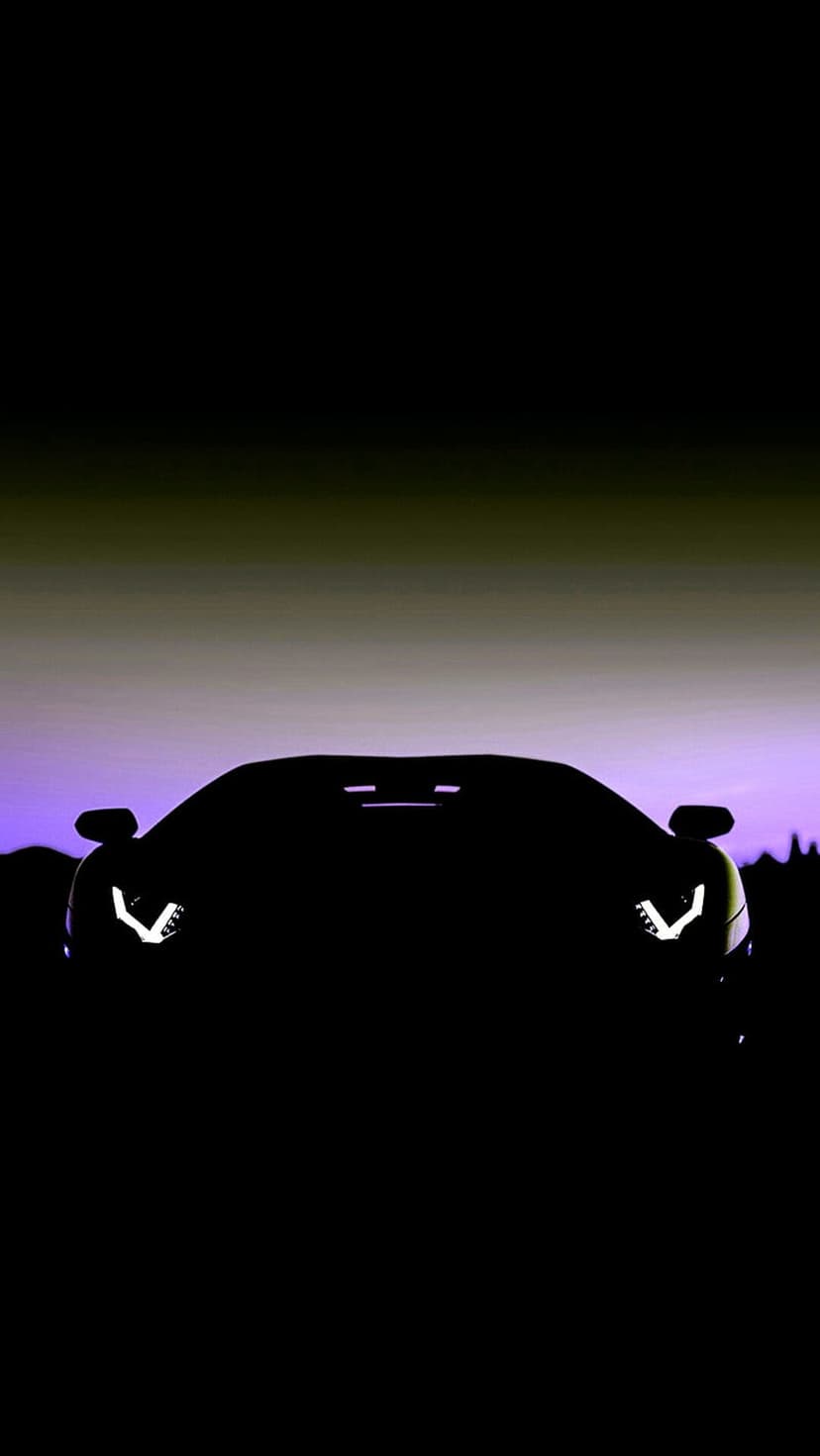 Sleek sports car silhouette featuring bright headlights against a purple and green dusk sky backdrop.