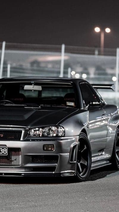 Sleek Silver Nissan Skyline R34 GT-R at Night