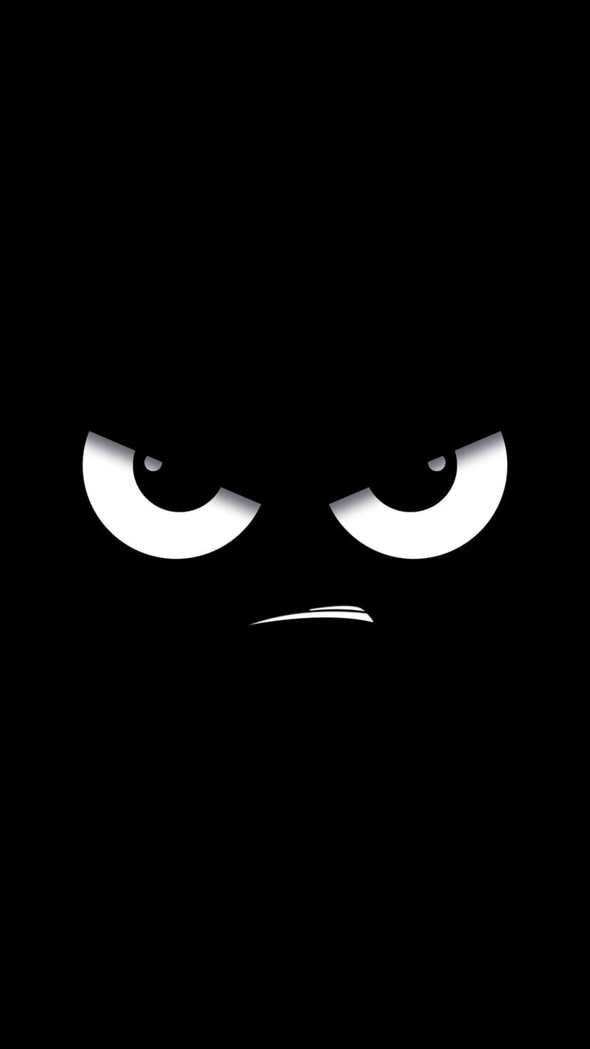 Angry white cartoon eyes with a small scowling mouth centered on a solid black vertical background.