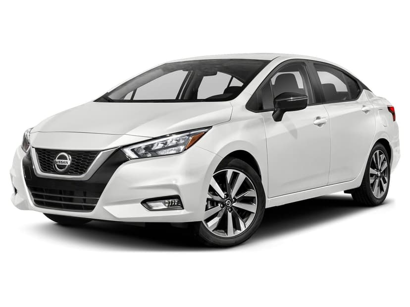 White Nissan Versa sedan in a front three-quarter view with black accents and alloy wheels on a white background.