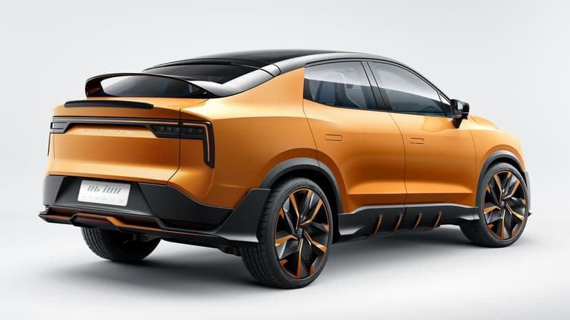 Metallic orange concept SUV featuring a coupe roofline, dual rear spoilers, and orange accented wheels in a studio.