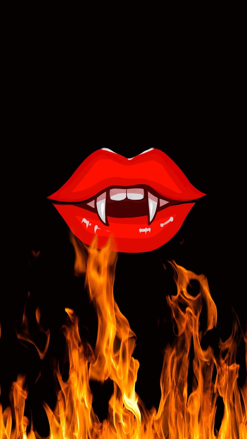 Sharp vampire fangs and glossy red lips surrounded by vibrant orange flames against a solid black backdrop.