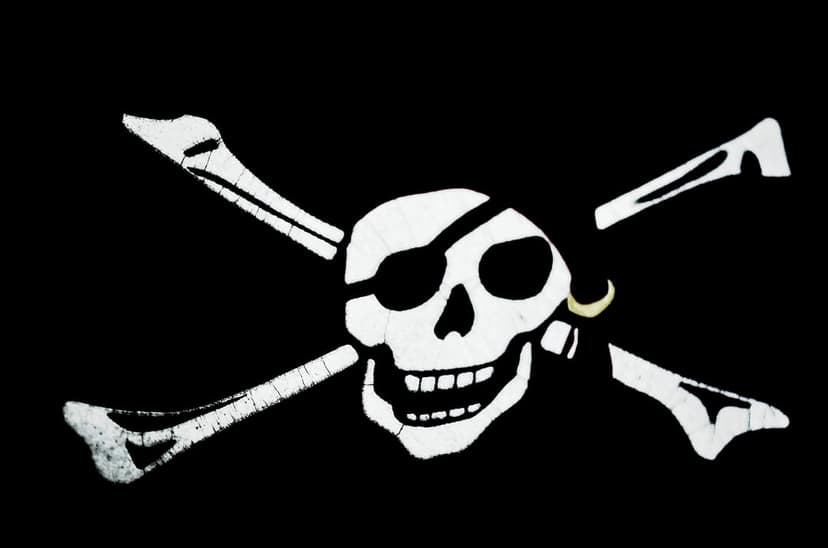 White pirate skull with an eye patch and crossed bones centered on a solid black background for a sharp contrast.