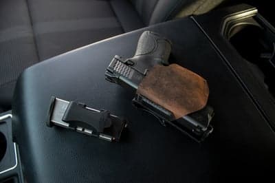 Pistol and Magazine on Car Center Console