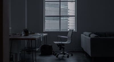 Dimly Lit Modern Office with City View