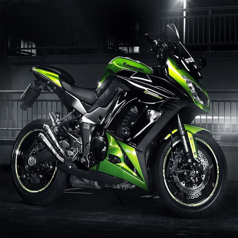 Kawasaki Ninja 1000SX sportbike in green and black features aerodynamic fairings and a dual-beam headlight.