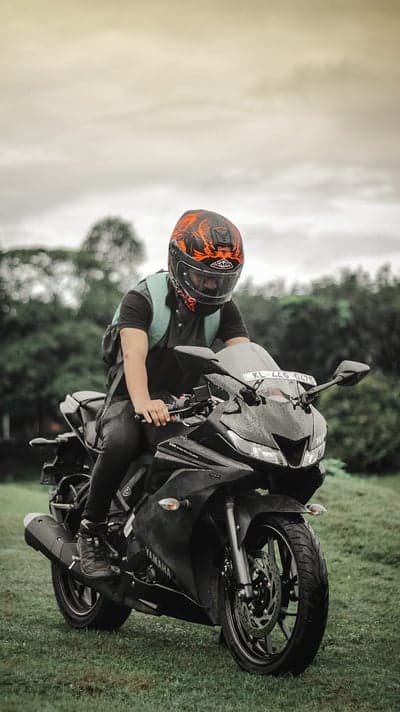 Rider on Yamaha motorcycle in grassy field