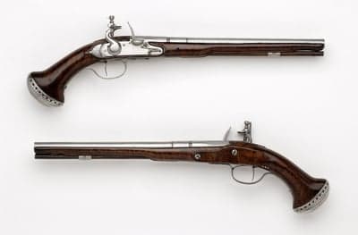 Antique Flintlock Pistols with Ornate Handles