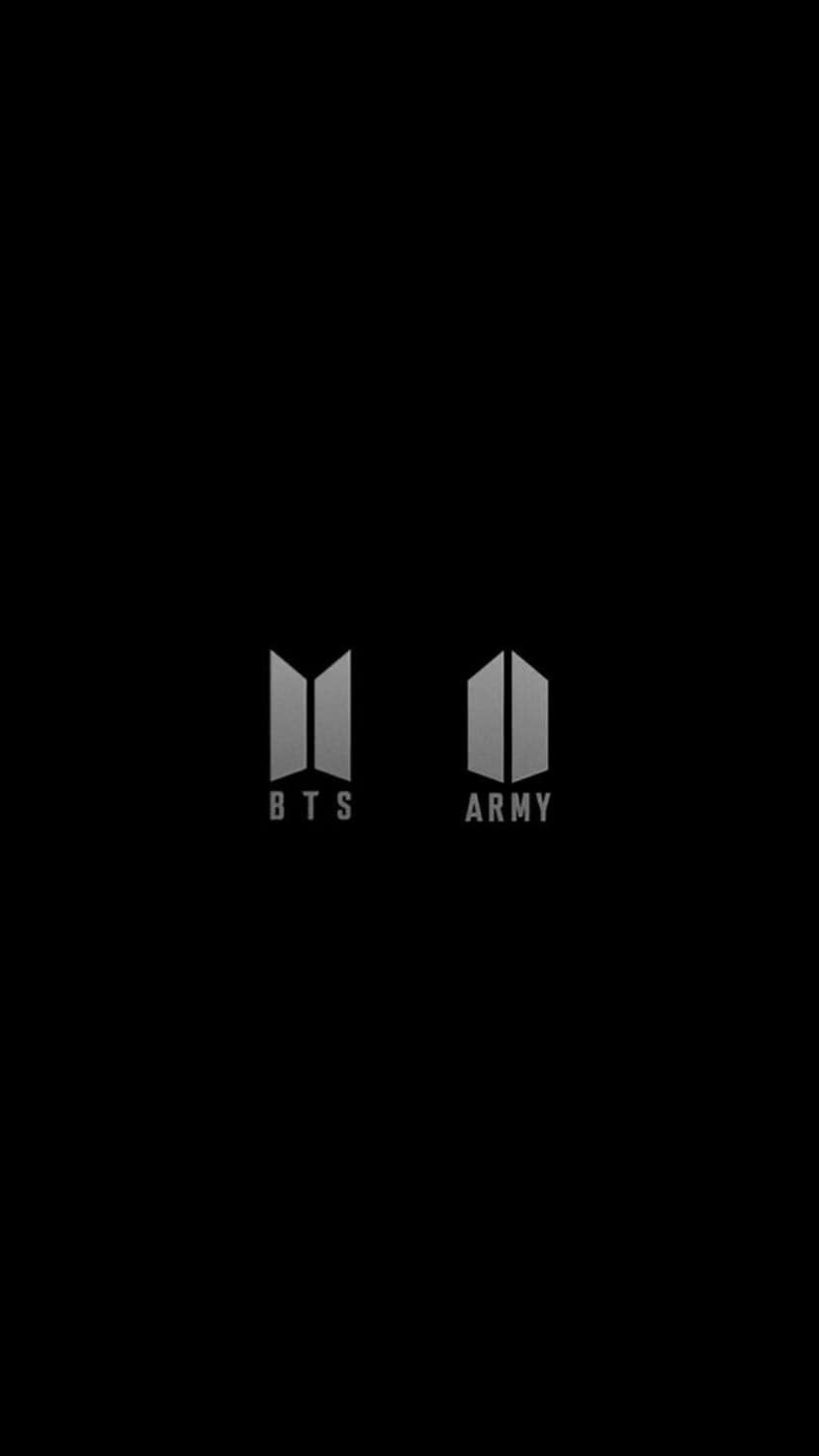 Dual BTS and ARMY insignias with a brushed gray metallic finish centered on a solid black vertical surface.