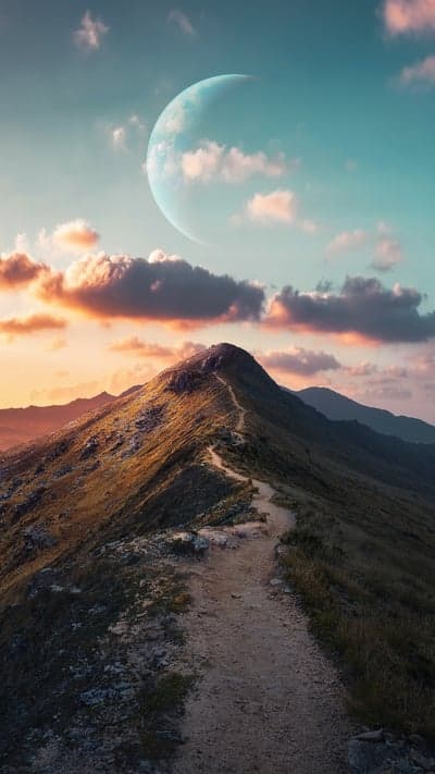 Mystical Planet Over Mountain Ridge at Sunset