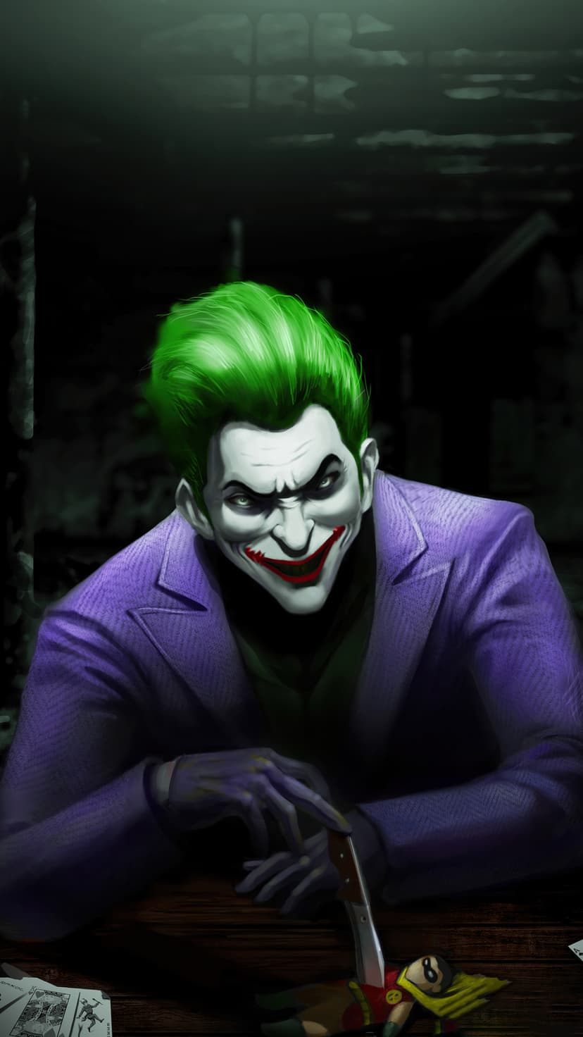 Joker with green hair and purple suit points a knife at a small Robin toy on a dark table with cards.