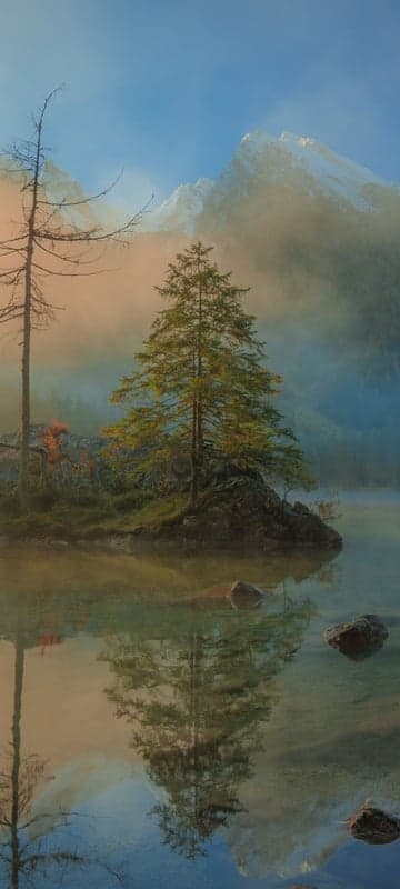 Misty Mountains and Serene Lake Reflection