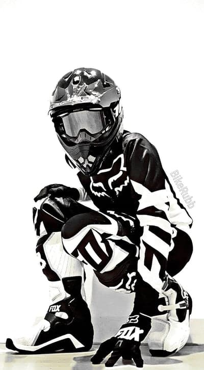 Motocross Rider in Full Gear Crouching