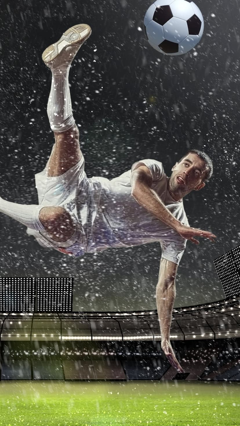 Soccer player performs a mid-air bicycle kick in a rain-filled stadium under bright evening floodlights.