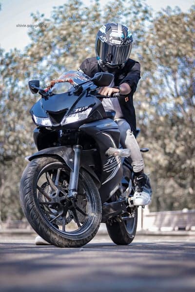 Rider on a Black Sportbike with Full-Face Helmet