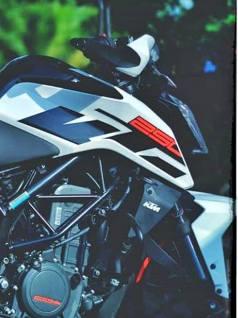 KTM 250 Duke motorcycle front with white graphics, orange 250 decal, trellis frame, and detailed engine components.