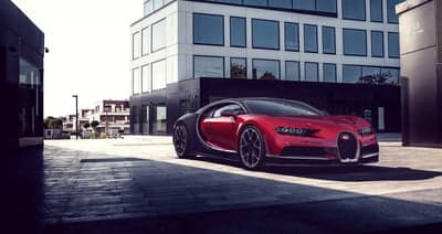 Red Bugatti Chiron Luxury Supercar in Modern Urban Setting