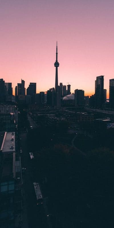 Pink Horizon Over City Skyline - Twilight's Urban Glow