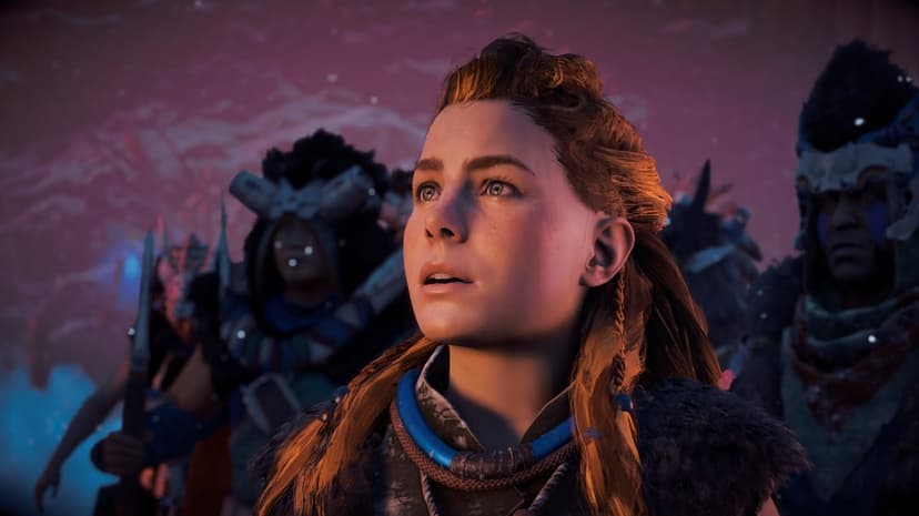 Aloy looking upward with wonder, her red hair and freckles lit by golden light in a tribal setting.