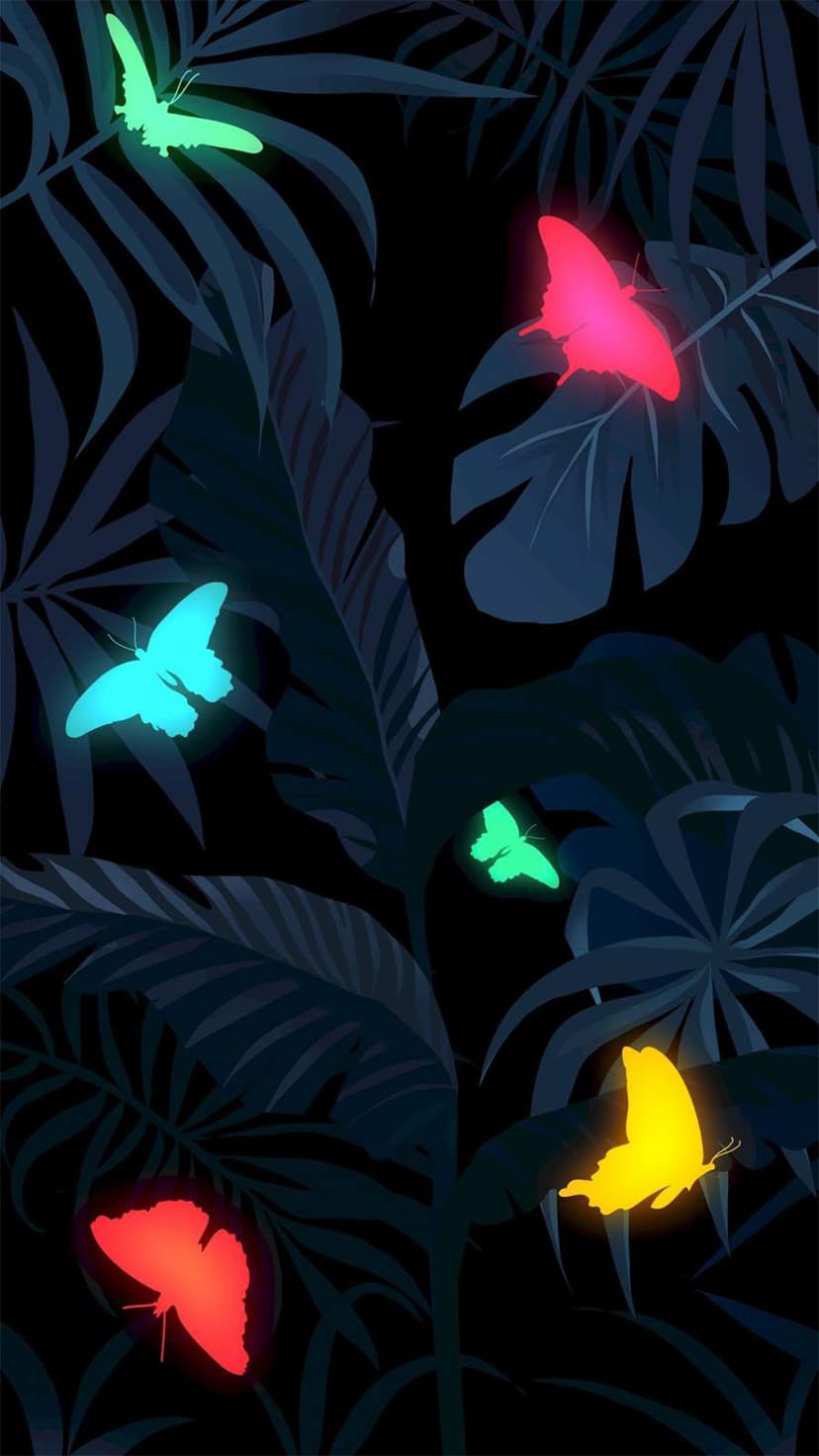 Glowing neon butterflies in shades of pink and blue fly among dark shadowed tropical leaves in a night forest.