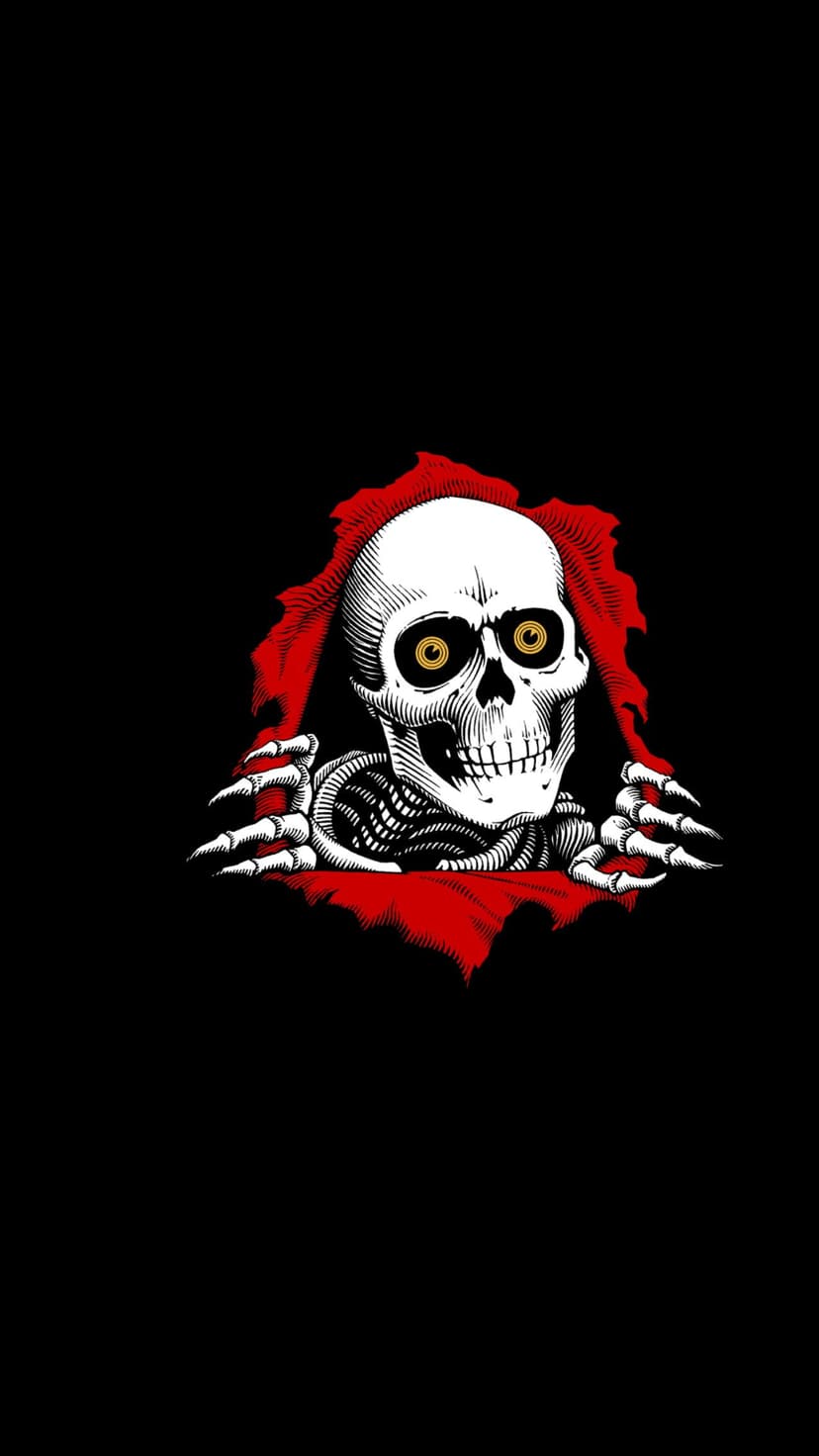 White skeleton with glowing yellow eyes tears through a vertical rip in textured red fabric against a black backdrop.