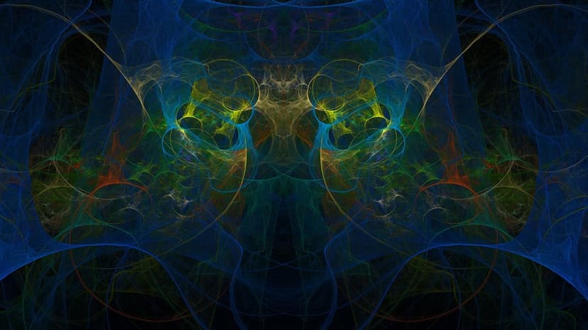 Intricate blue and yellow fractal patterns swirl in an organic nebula formation with deep cosmic depth and light.