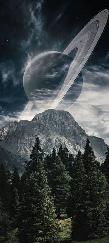 Saturn Over Mountainous Forest Landscape