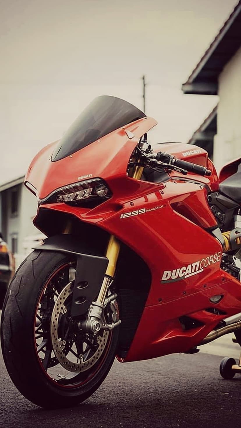 Ducati 1299 Panigale Corse motorcycle with LED headlights, dual disc brakes, and gold-accented front suspension.