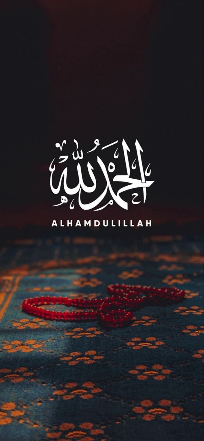 White Arabic calligraphy positioned above crimson prayer beads on a teal floral rug with soft lighting.