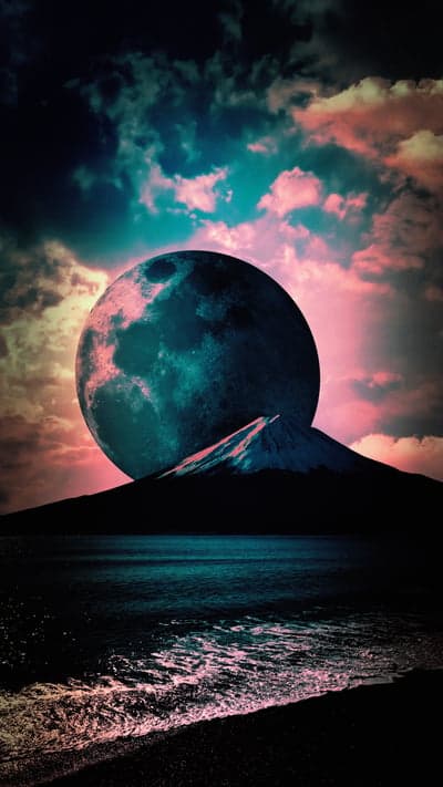 Surreal Moon Over Mountain and Ocean at Sunset