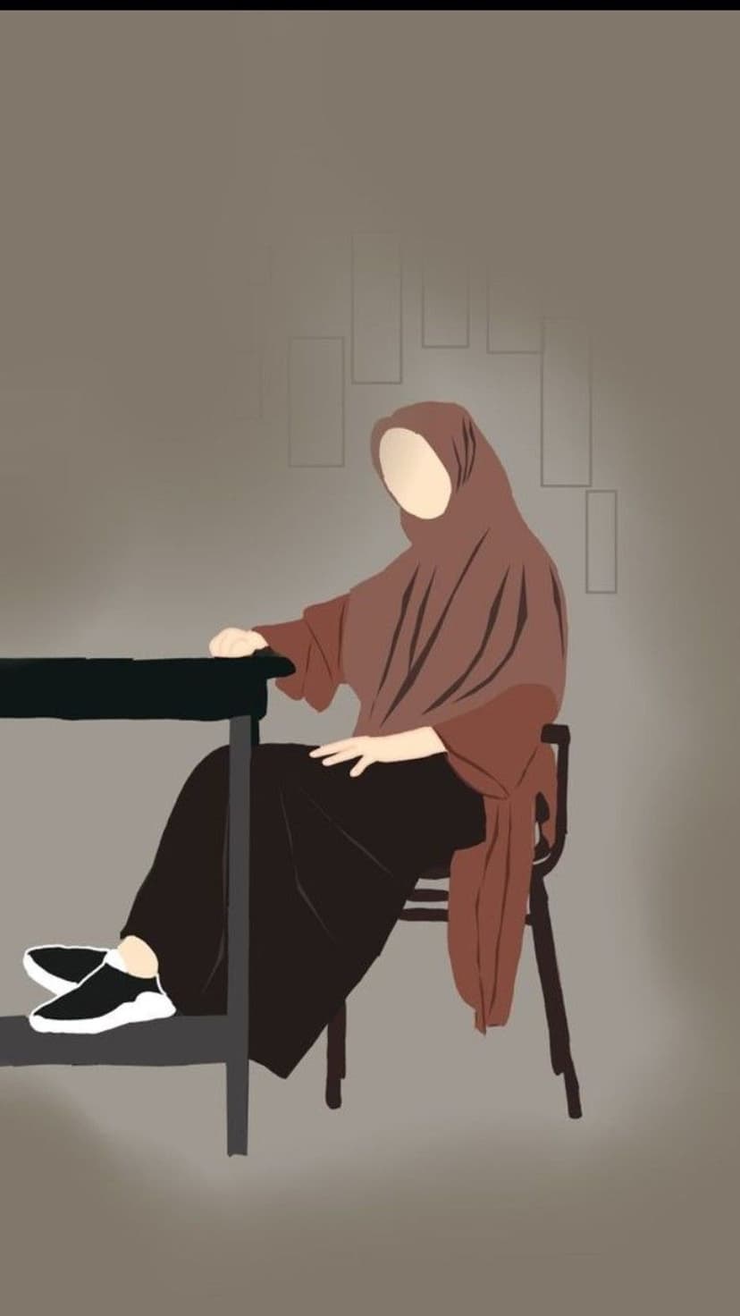 Faceless woman wearing a brown hijab and dark dress sits at a black desk in black and white sneakers.