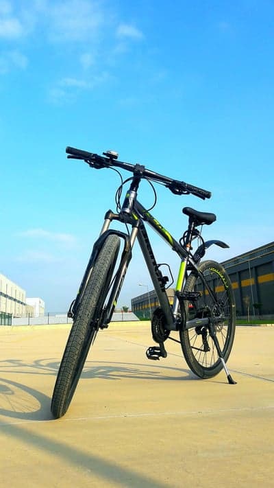 Neon Green Accented Mountain Bike Urban Mobile Wallpaper